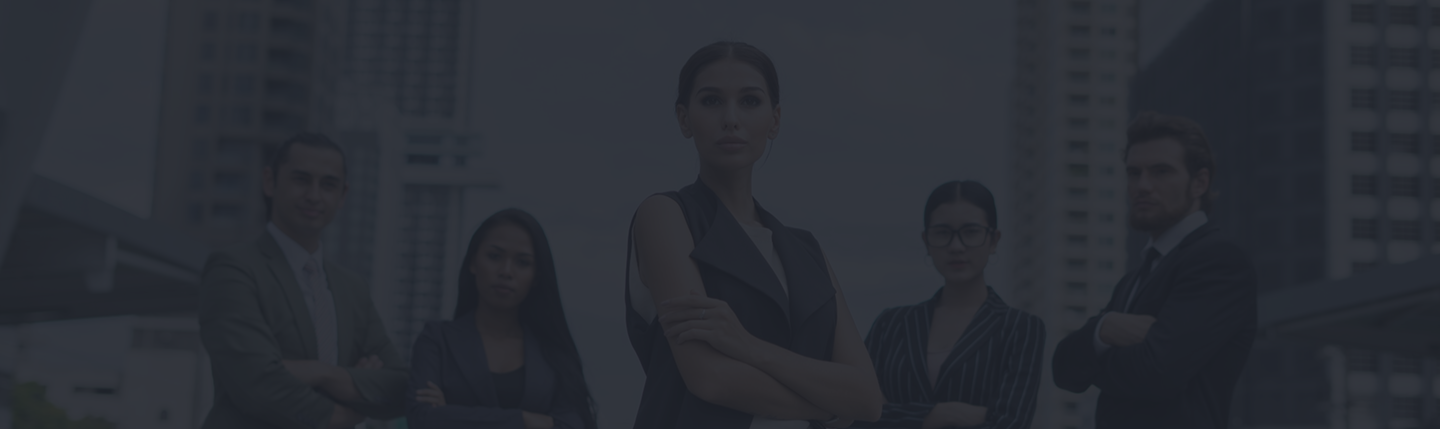 Group of professionals in business attire standing confidently with arms crossed, representing teamwork and expertise in group insurance solutions.