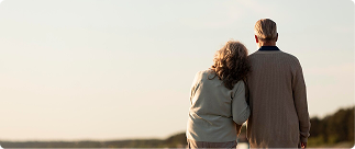 Couple enjoying a peaceful moment together outdoors, symbolizing the benefits of Indexed Universal Life insurance for retirement income planning.