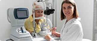 Optometrist assisting senior woman during eye exam, highlighting importance of vision care for seniors over 50.