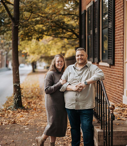 Matthew and Ashley Noe, licensed insurance agents, standing together in a picturesque outdoor setting with autumn foliage, representing their commitment to serving Lexington, Kentucky, and surrounding areas.