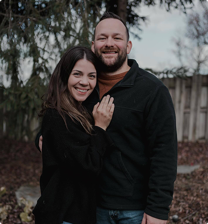 Nick Potter & Spouse, smiling together outdoors, embodying a personal approach to client relationships in insurance.