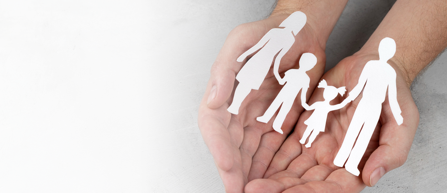 Hands holding paper cutouts of a family, symbolizing personalized insurance solutions for individuals and families.