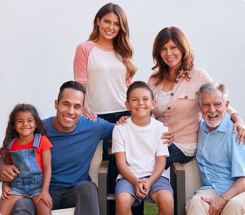 Family of six smiling together outdoors, representing diverse household sizes and unity, relevant to Amerus Financial's focus on assisting families with ACA health insurance coverage and subsidy eligibility.